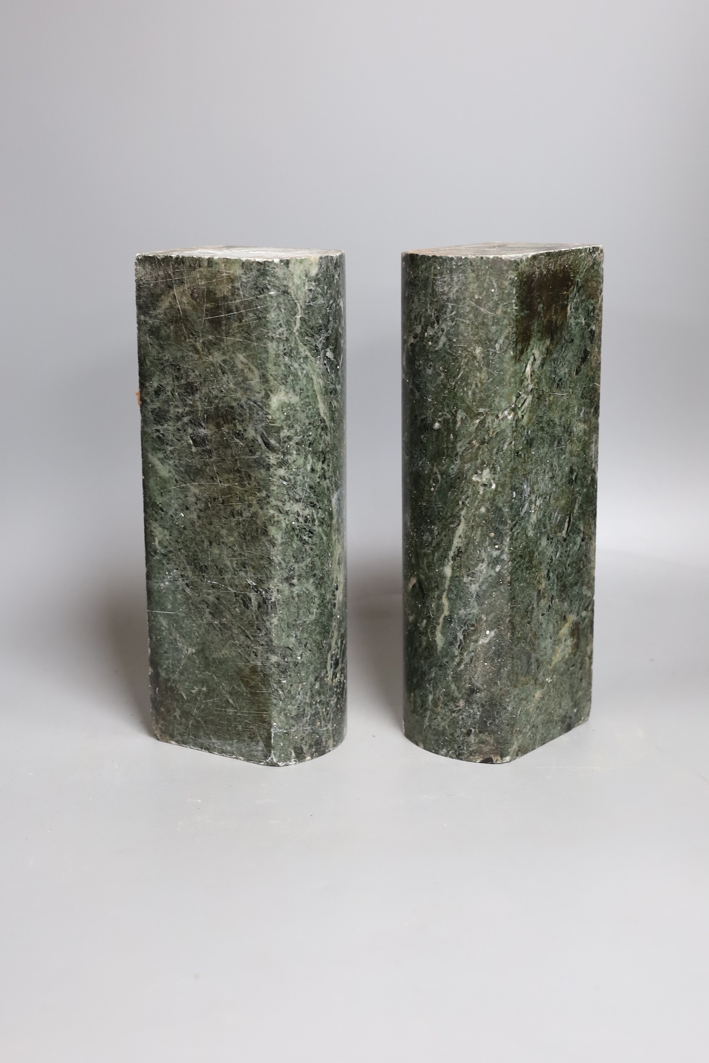 Two 19th century polished serpentine bar weights - combined 28 x 21cm